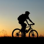 istock sunset bike rider